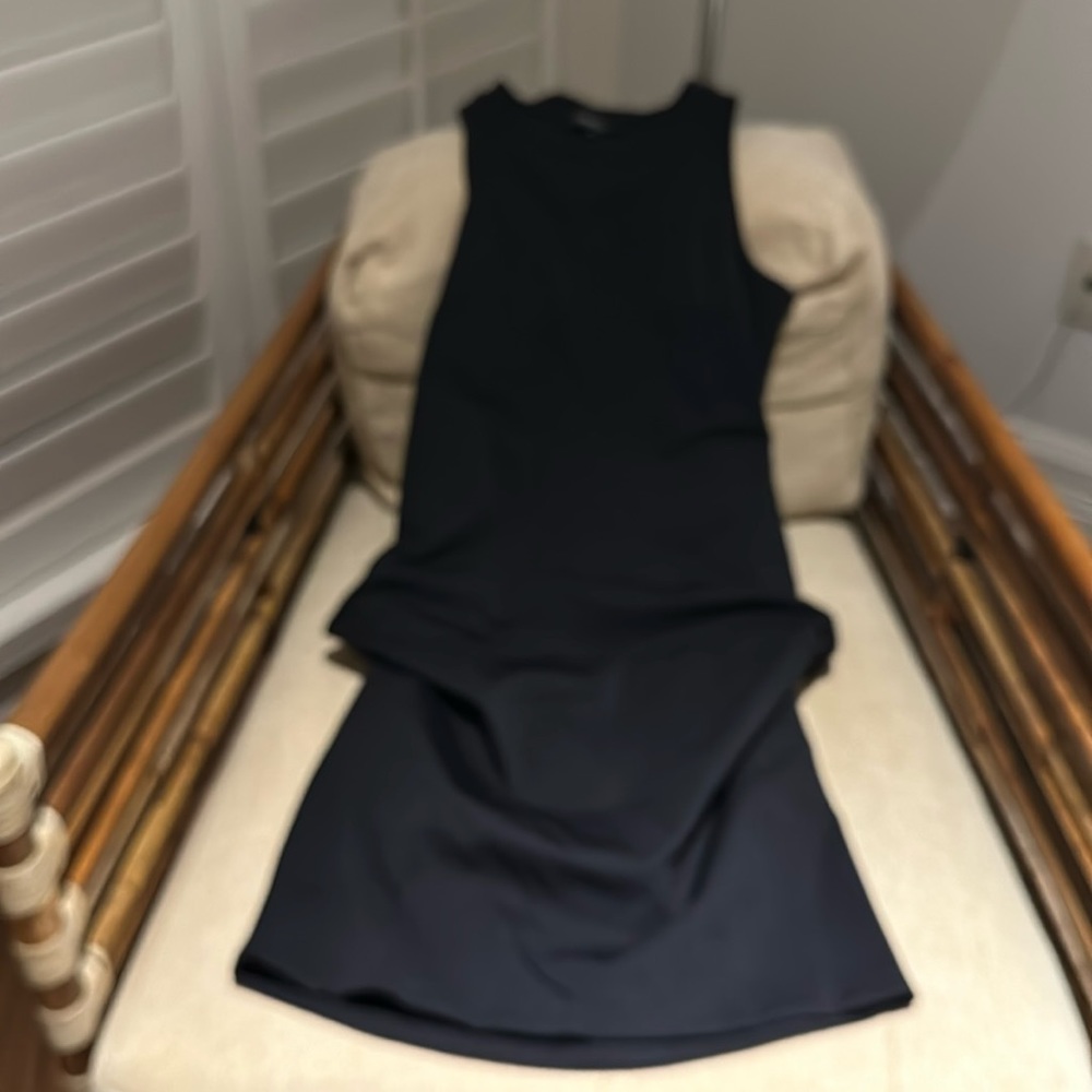 Exceptional dress with accentuated sides. Near architectural design. Wor…